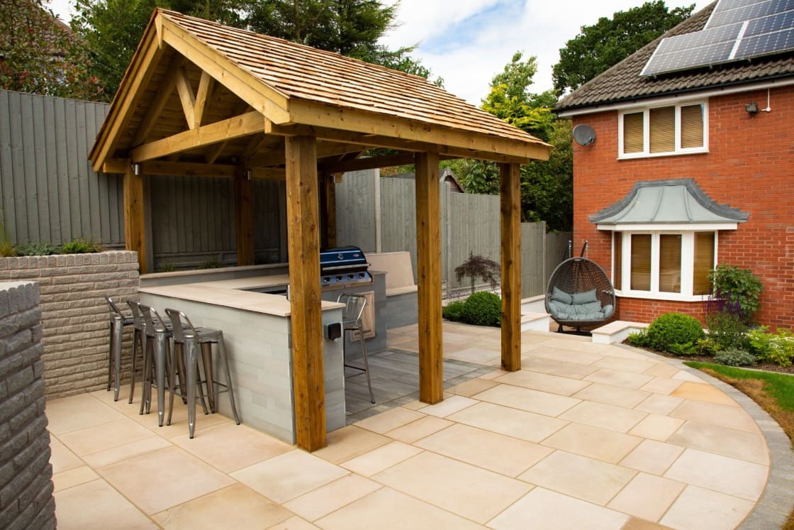 Oak garden shelter over outdoor kitchen