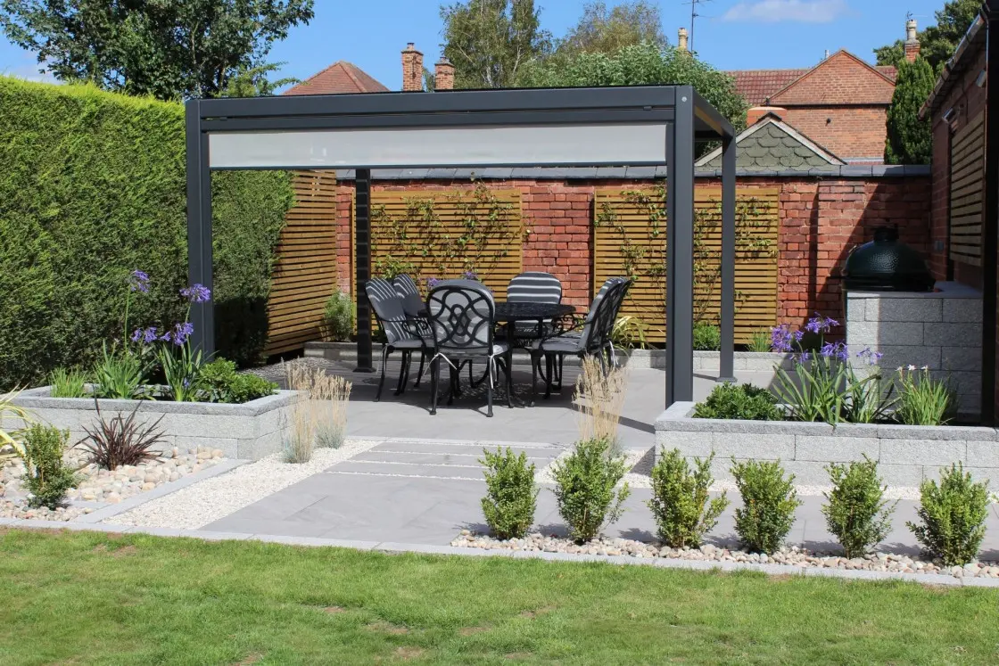 Outdoor dining area with built in BBQ